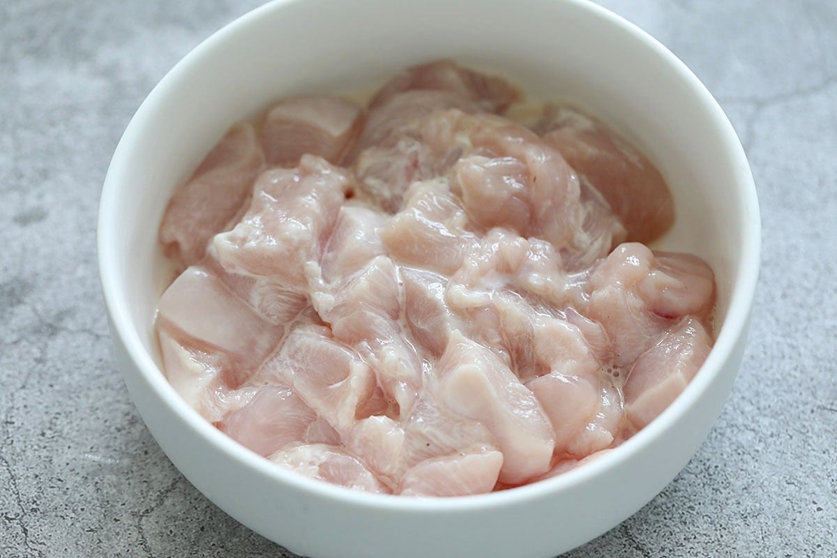 Velveting the chicken cubes with cornstarch. 