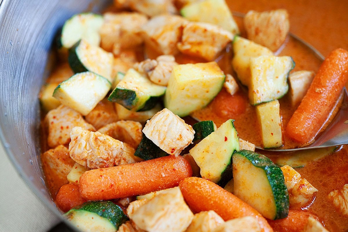 Thai zucchini curry recipe with coconut milk in a skillet.