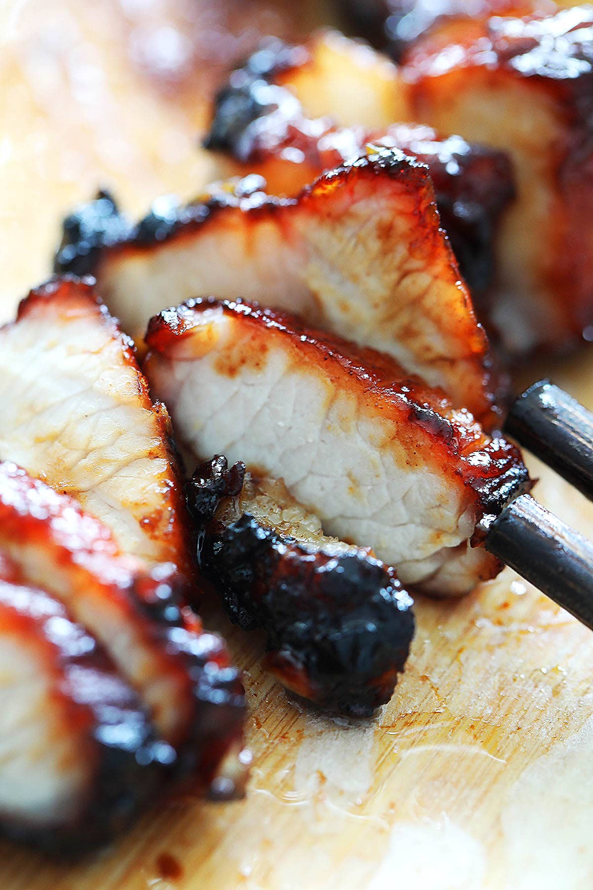 Air fryer barbecue pork belly recipe, charred to perfection with a sticky glaze.