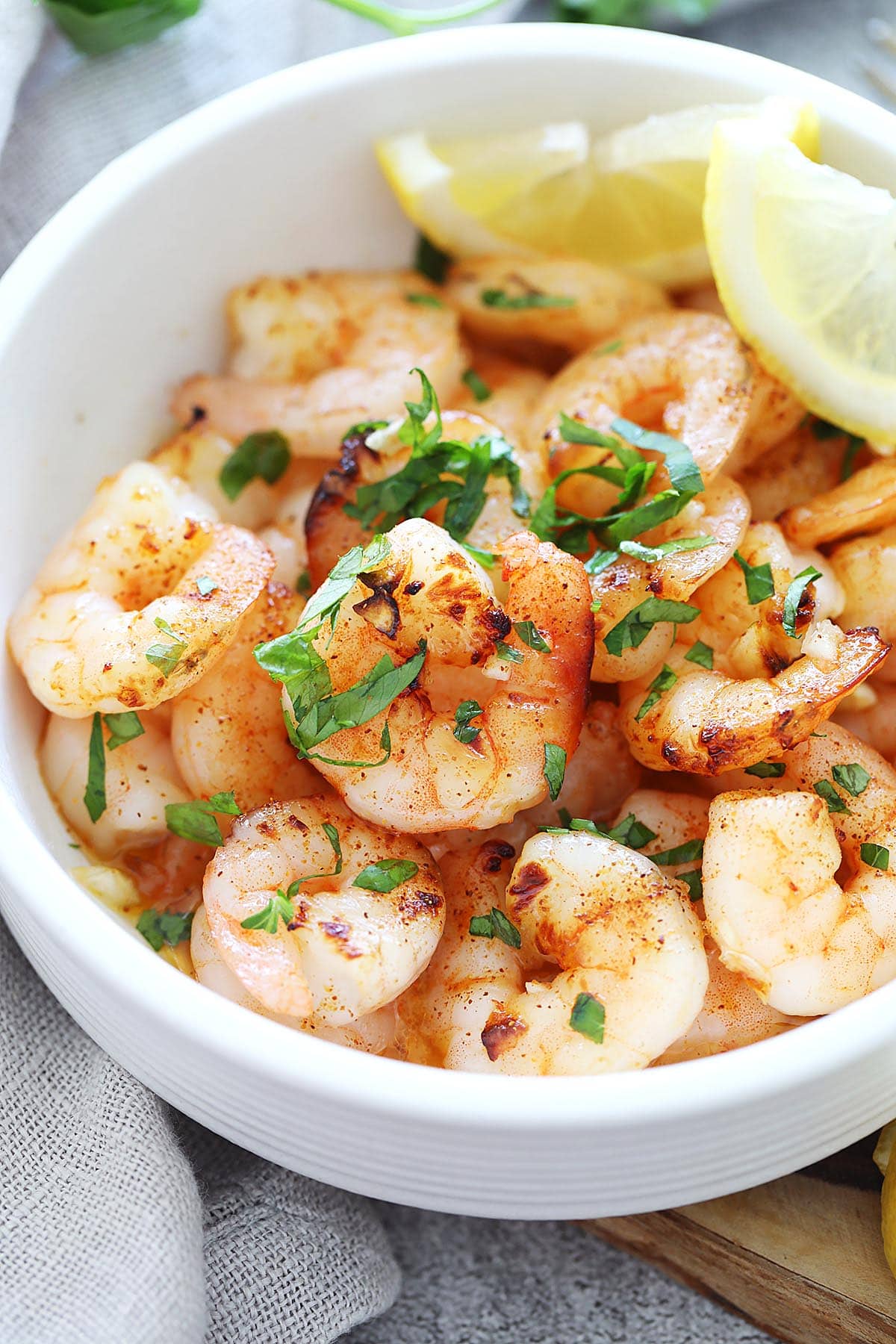 Air fryer honey garlic shrimp served in a bowl.