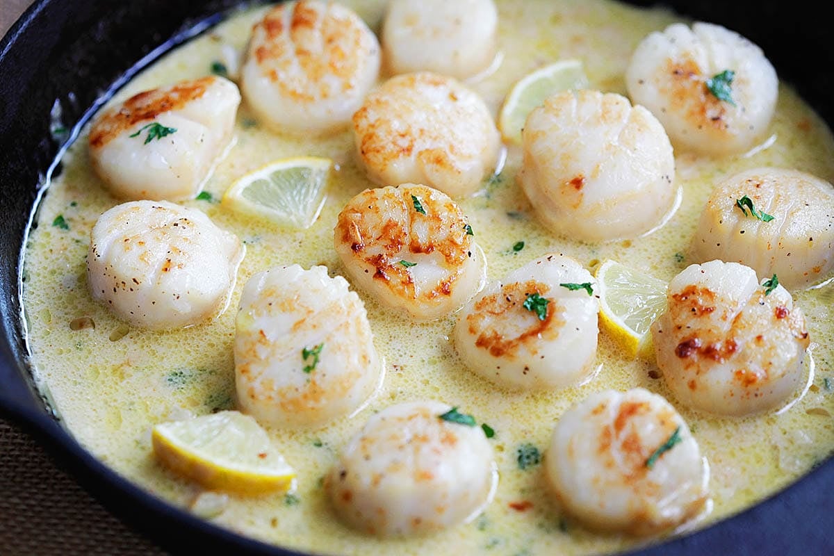 Creamy garlic sea scallop, perfectly pan-seared in a skillet.