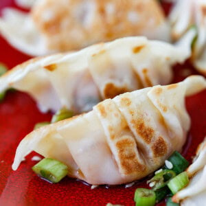 Kimchi dumplings served on a plate.