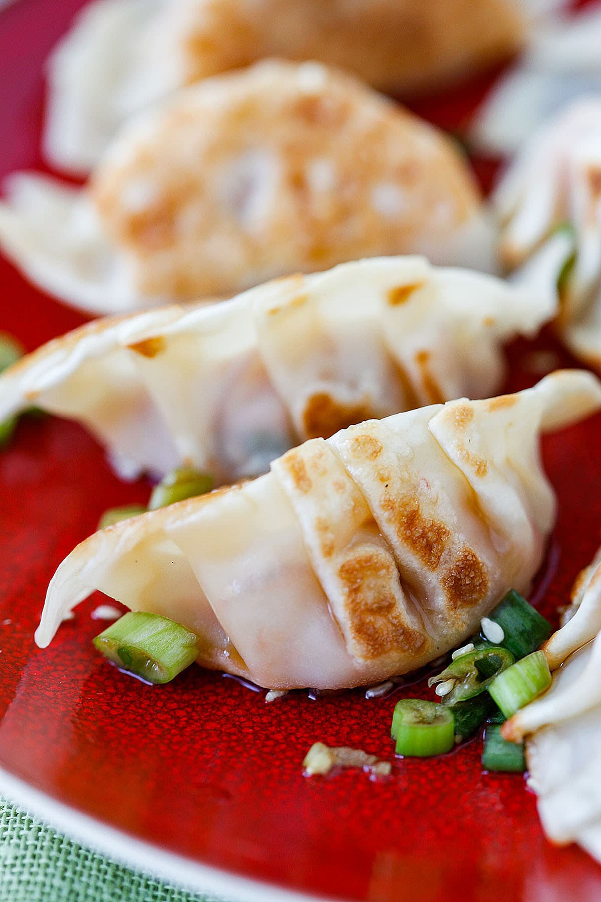 Kimchi dumplings served on a plate.