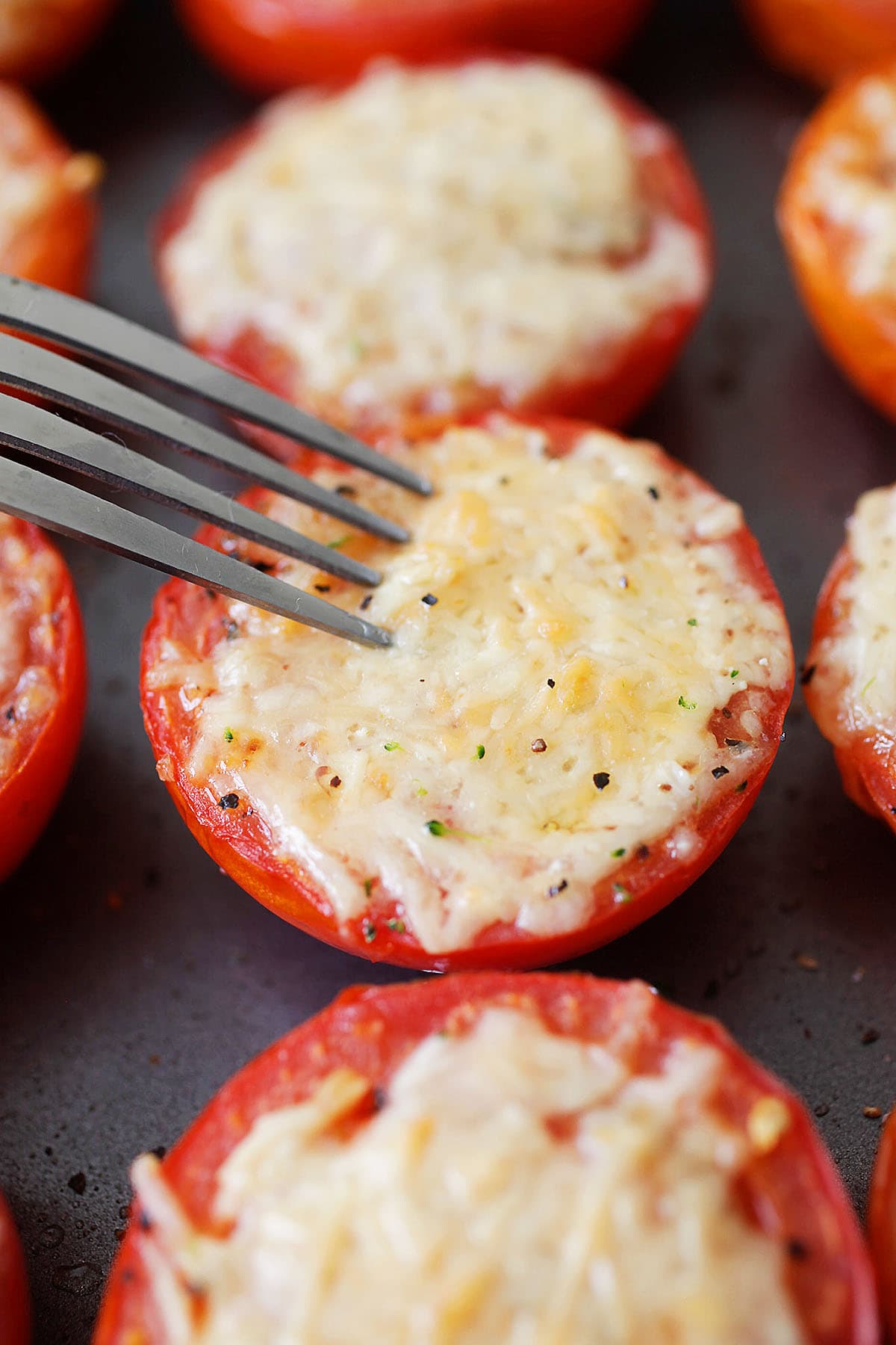 Cheesy, melty Parmesan roasted tomatoes, ready to serve.