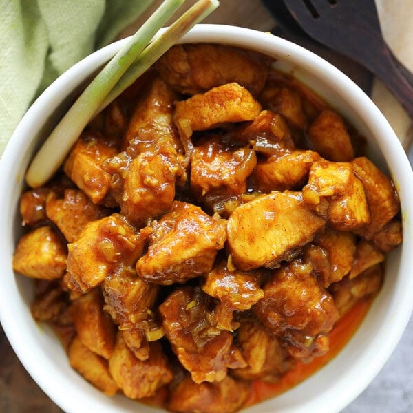 Vietnamese lemongrass chicken served with a bowl of rice.