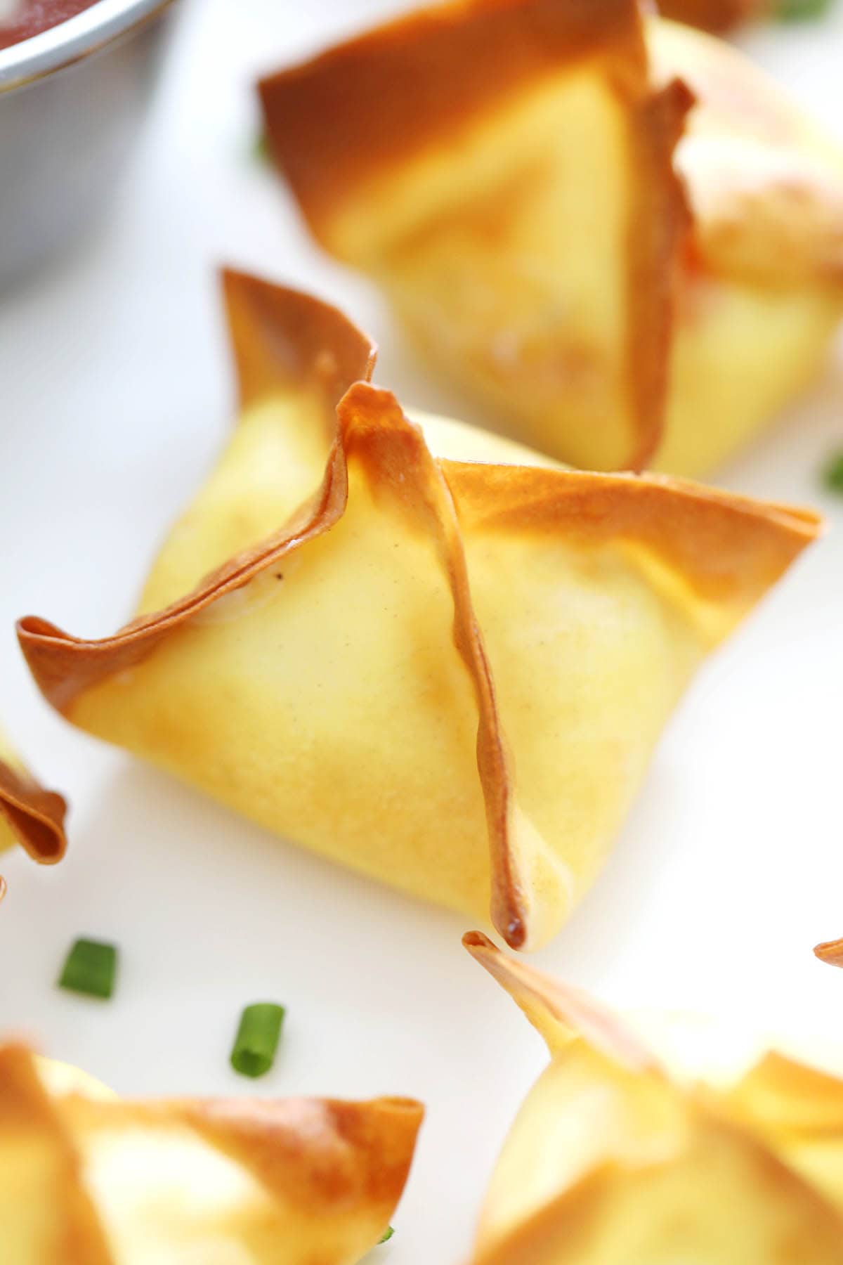 Air fryer wontons with creamy crab meat filling and crispy wonton wrappers.