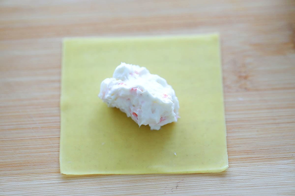 Creamy filling placed in the center of a wonton wrapper.