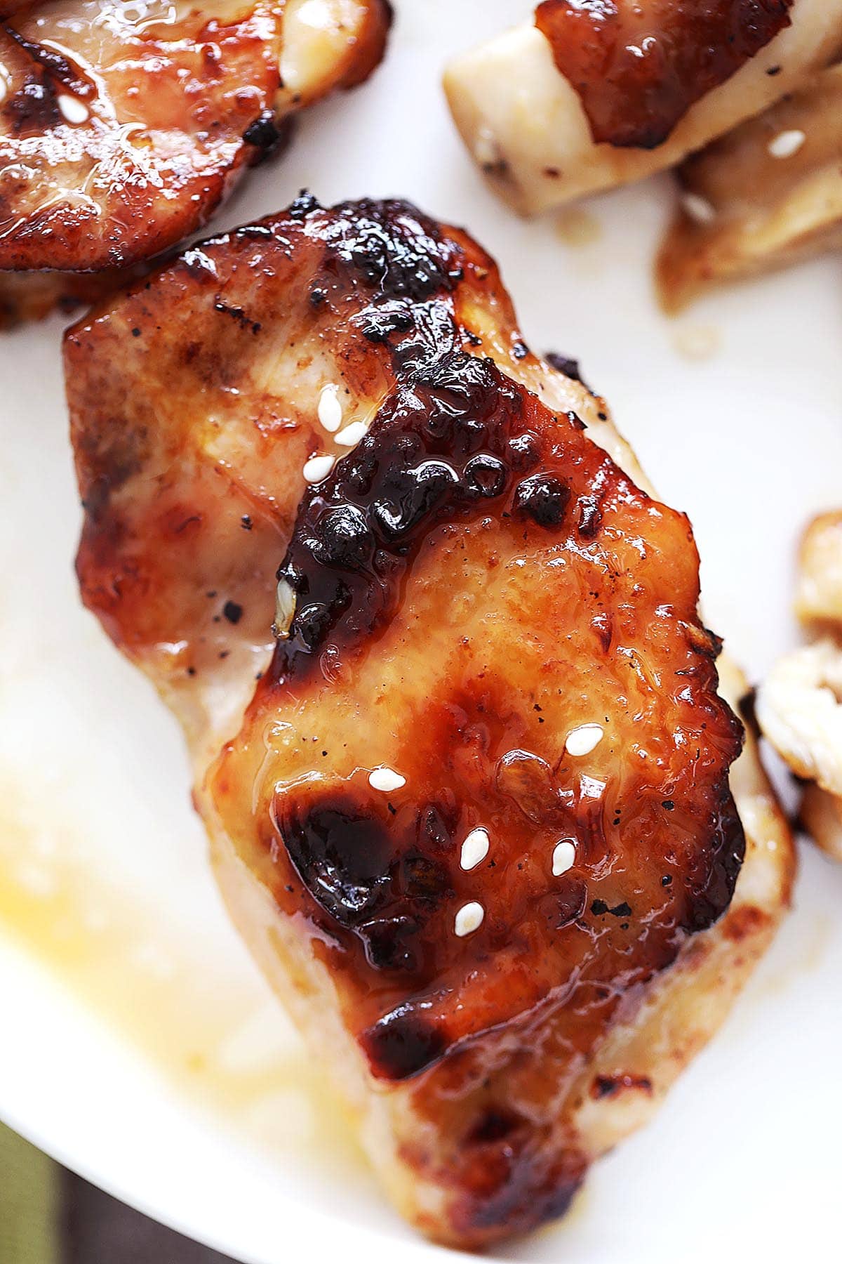 Honey garlic chicken thighs with golden skin, cooked in the air fryer.