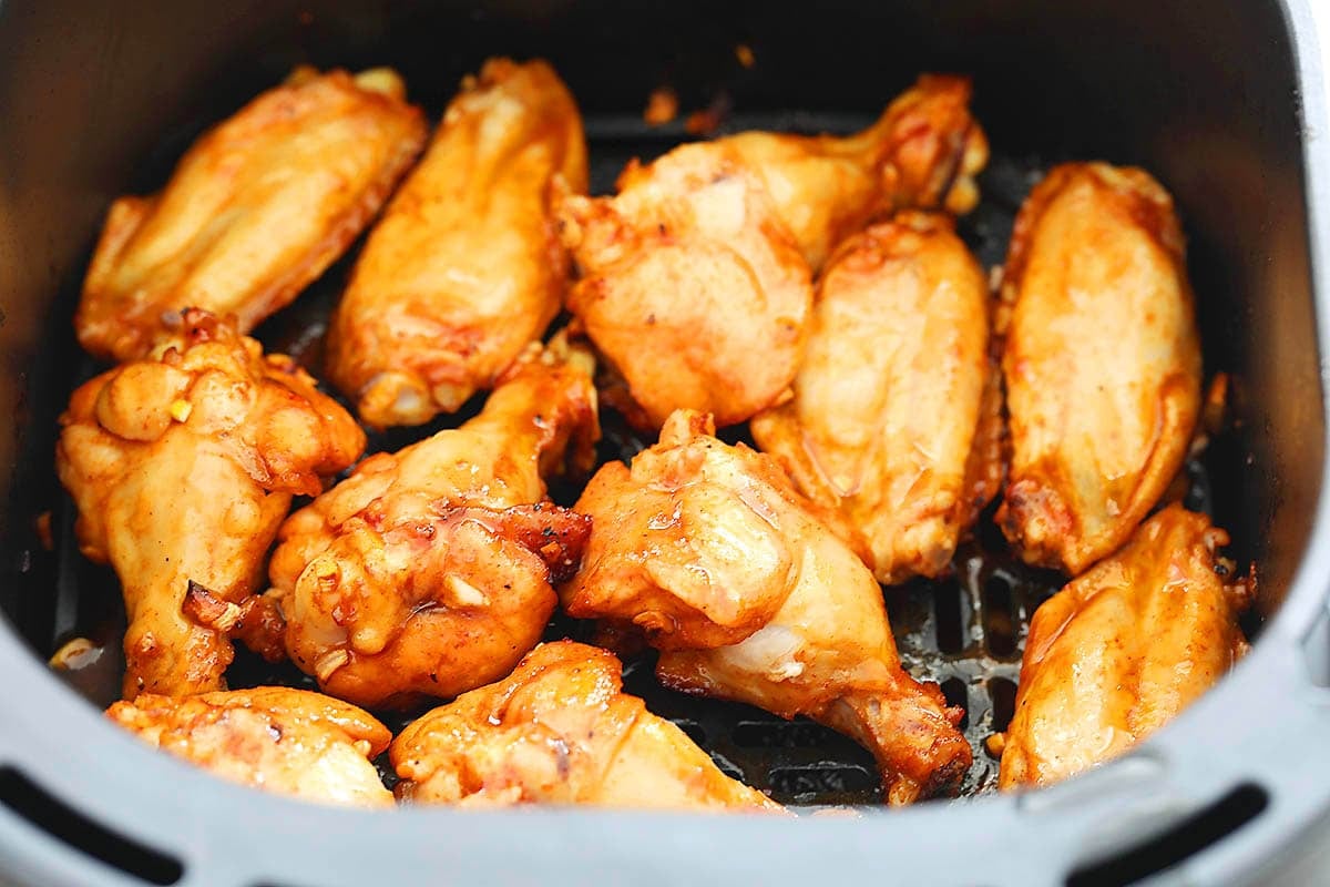 Spicy gochujang chicken wings in the air fryer basket.
