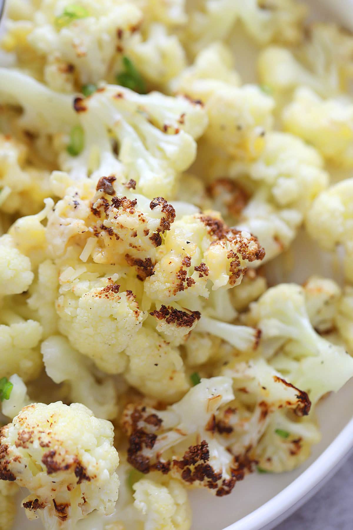 Air fryer Parmesan roasted cauliflower bites served on a plate.