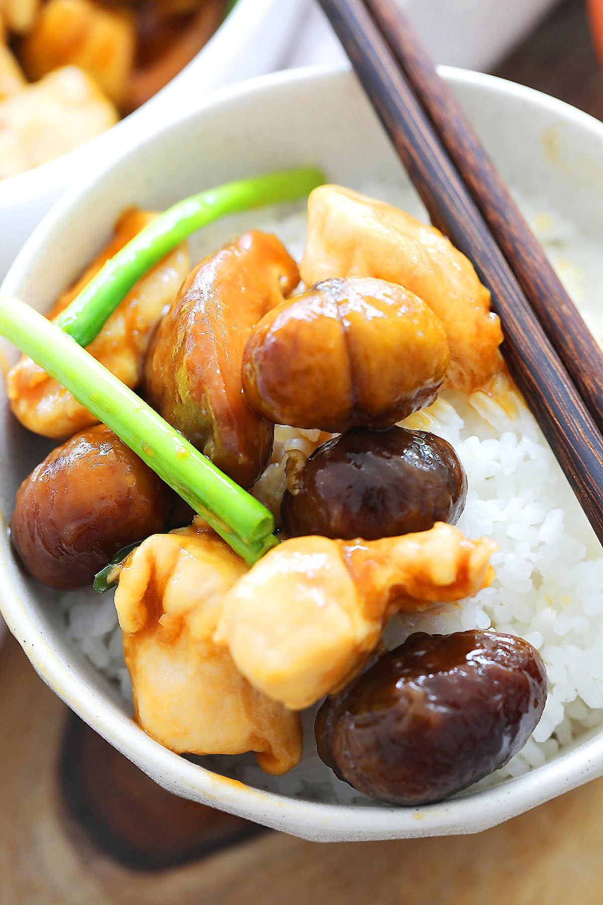Chestnut chicken recipe with shiitake mushrooms, served on steamed white rice.