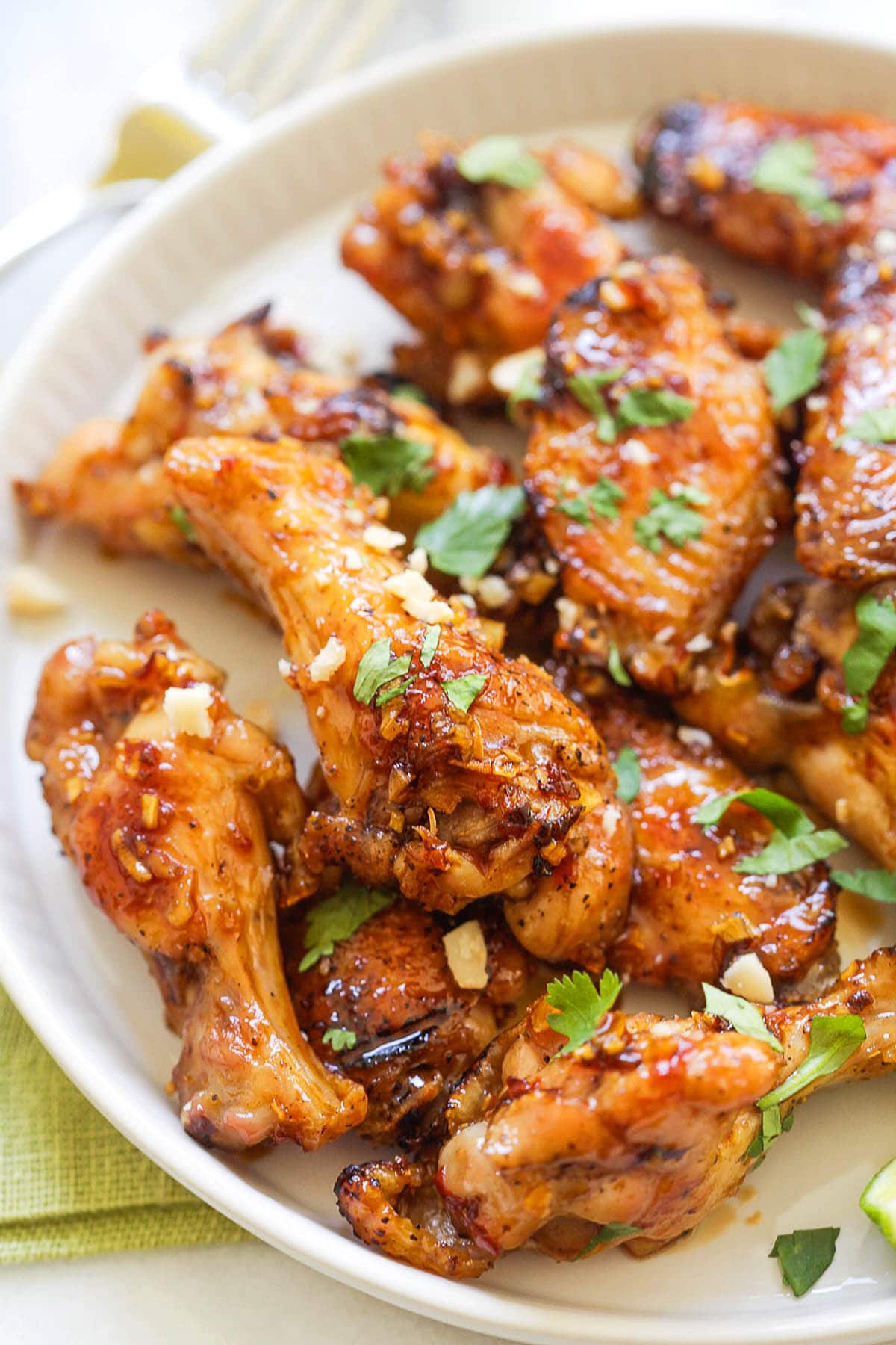 Sticky Vietnamese fish sauce chicken wings topped with cilantro.
