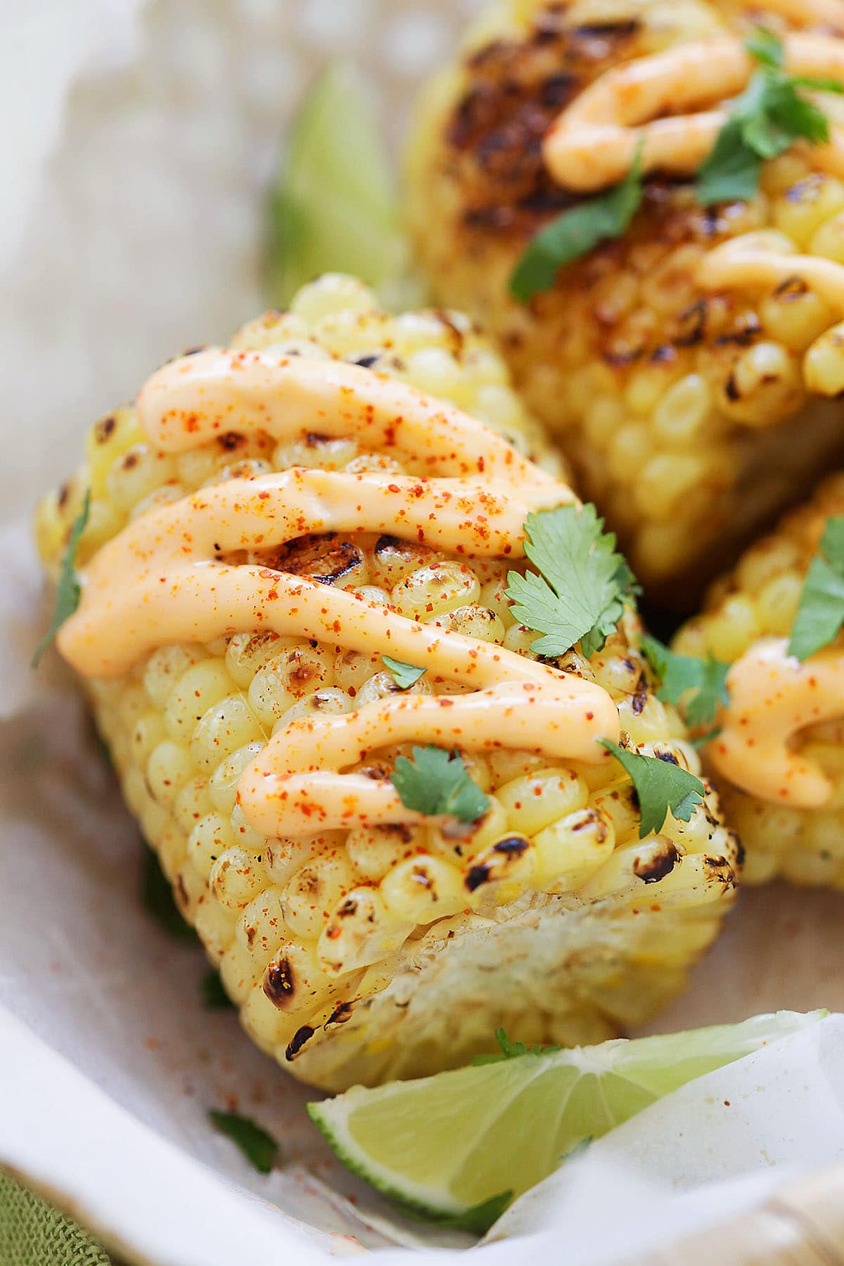 Mexican street corn topped with spicy mayo and cilantro.