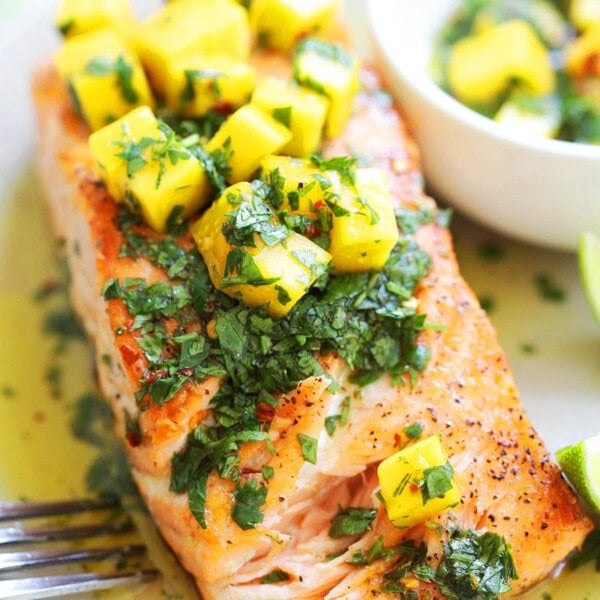 Easy grilled salmon with mango salsa recipe served with extra mango salsa on the side.