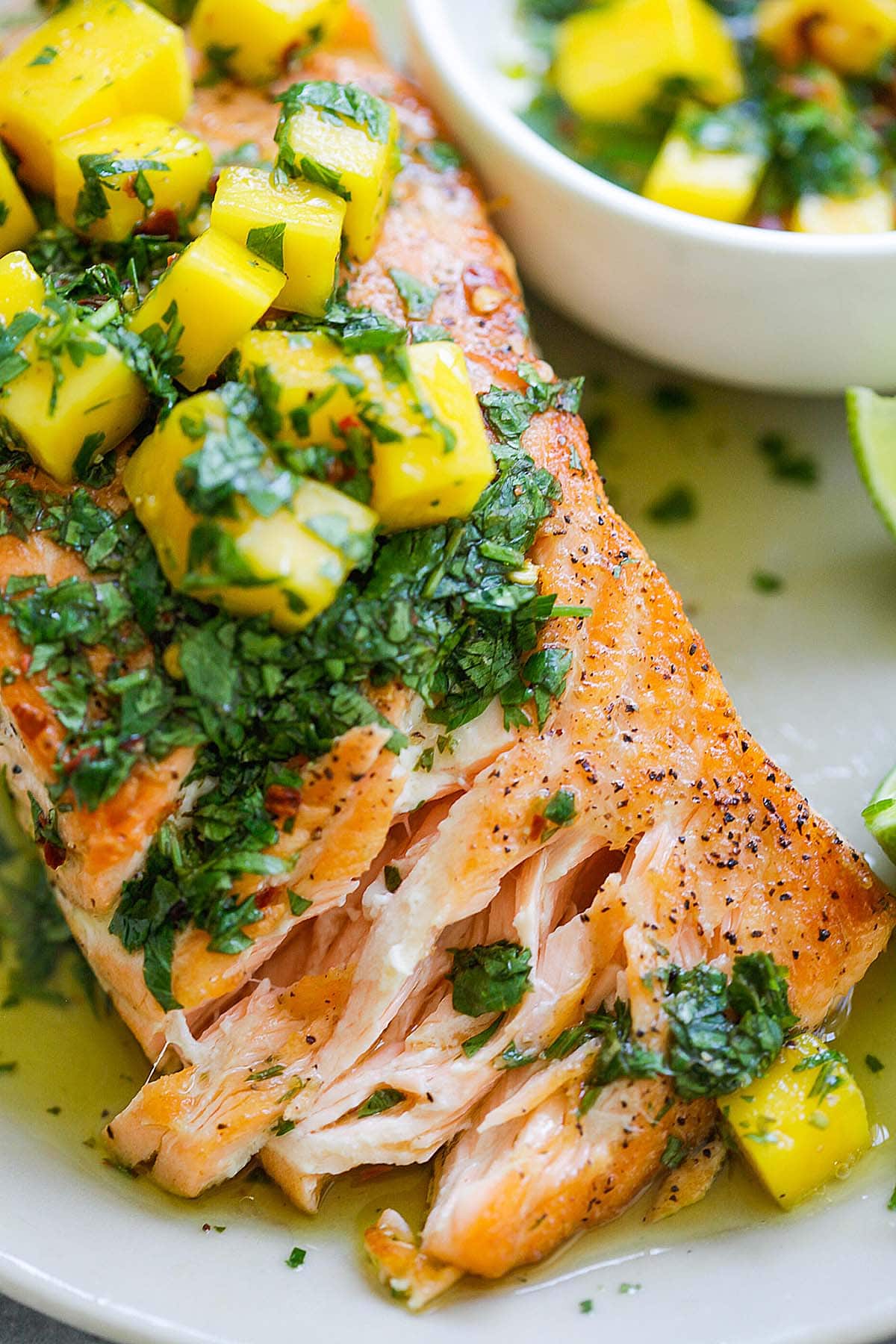 Flaky grilled salmon fillet topped with fresh mango salsa.