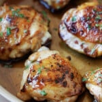 Honey balsamic chicken thighs in a skillet.