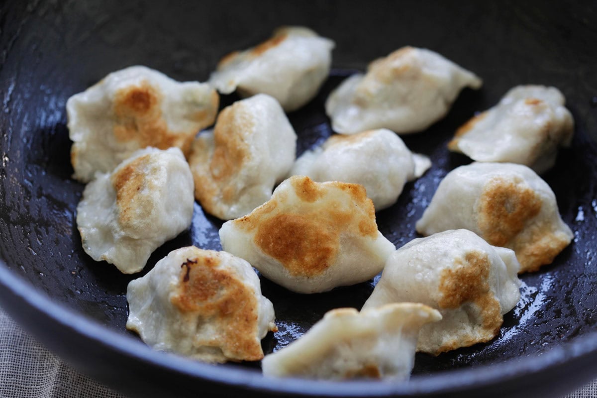 Easy pan fried dumpling in a wok.
