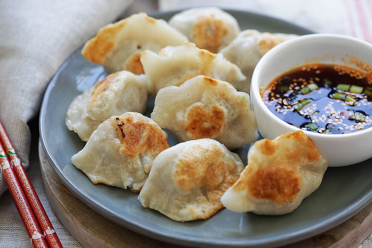 Pork, shrimp, and cabbage pan fried dumplings served with Chinese black vinegar dipping sauce.