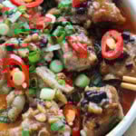Steamed pork ribs with black beans served in a plate.