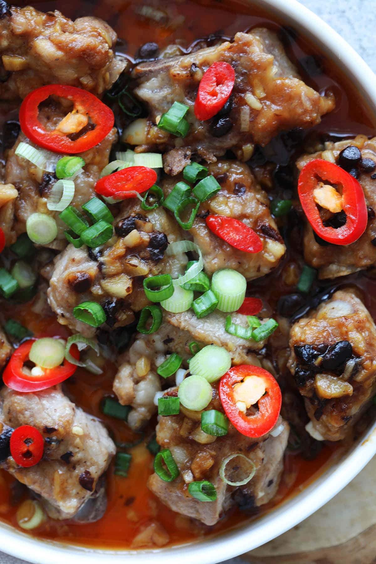 Steamed pork ribs just like at dim sum restaurants served on a plate.