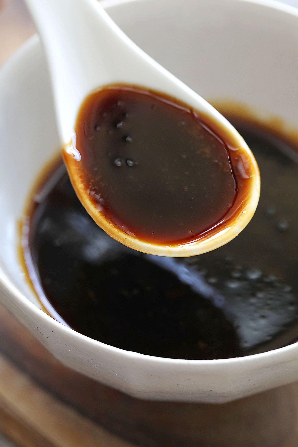 Spoonful of homemade teriyaki sauce.