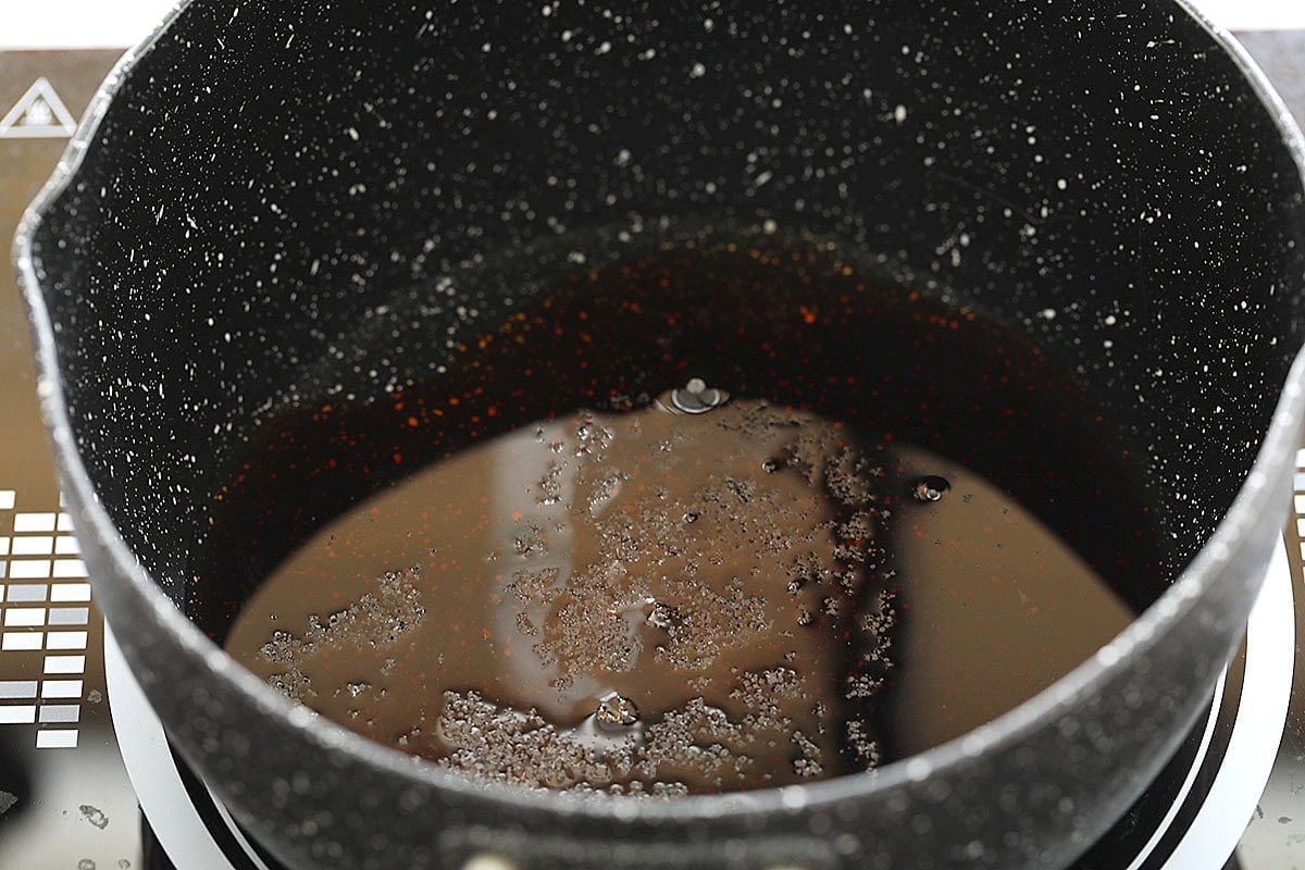 Mirin, soy sauce, and sugar in a saucepan.