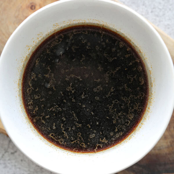 Chinese style steamed fish sauce in a bowl.