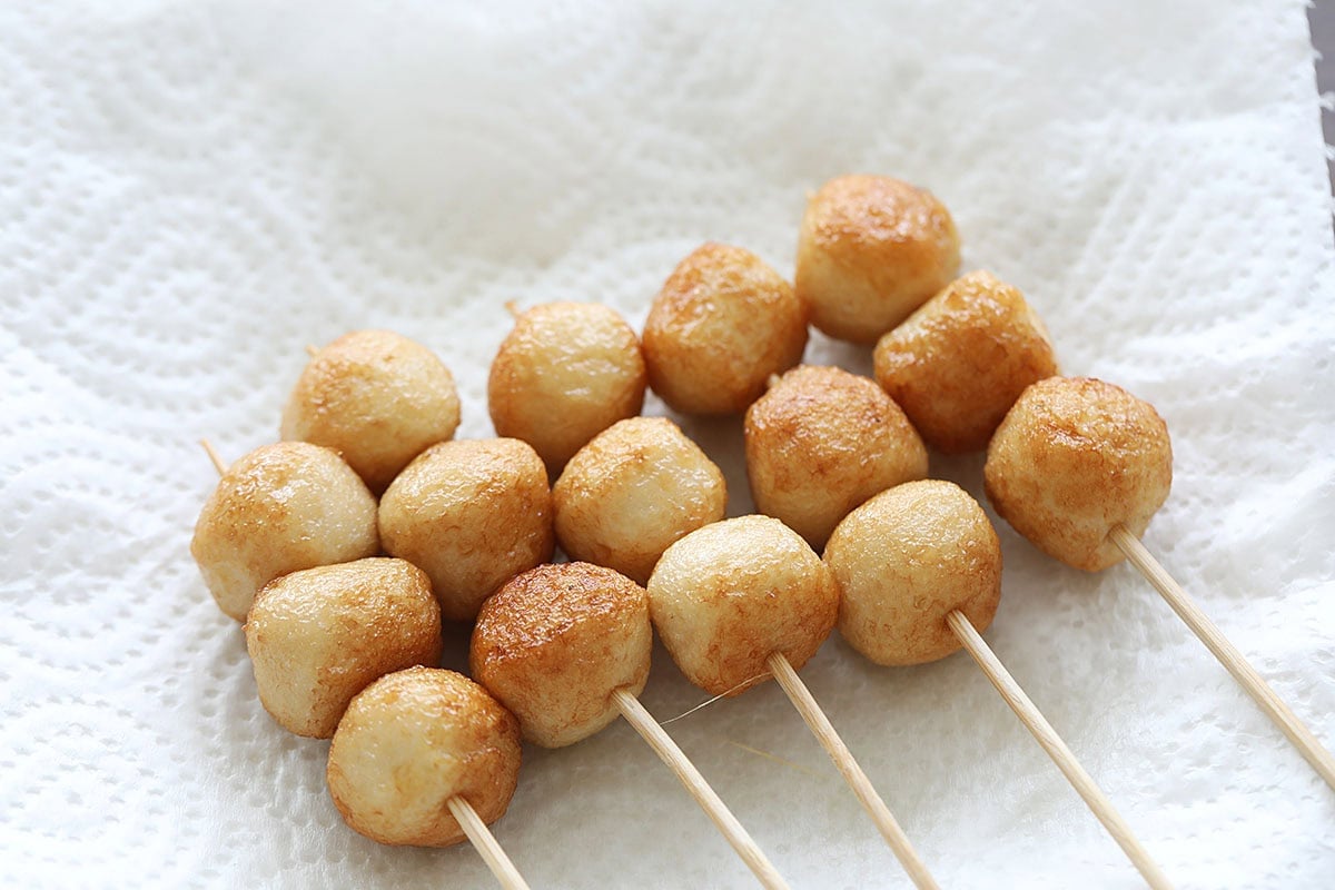 Fish ball skewers on a kitchen towel.