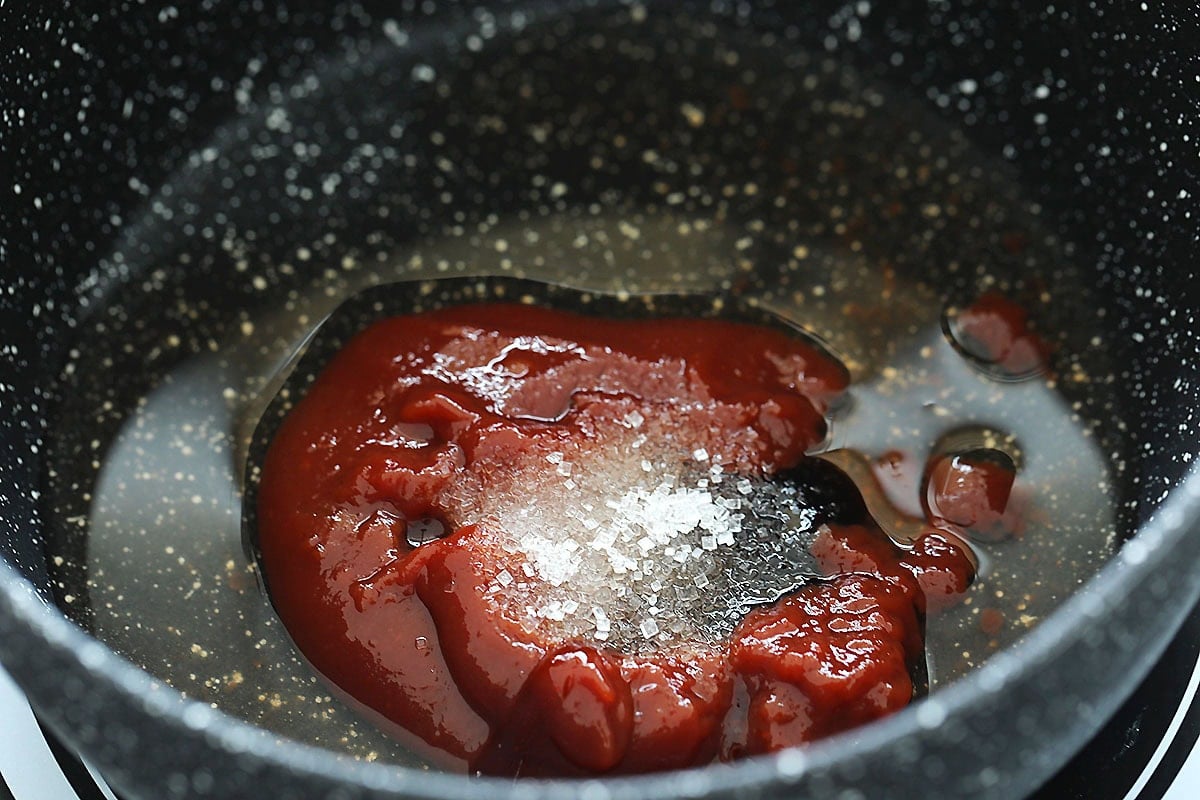 Chinese sweet and sour sauce ingredients in a saucepan before cooking.