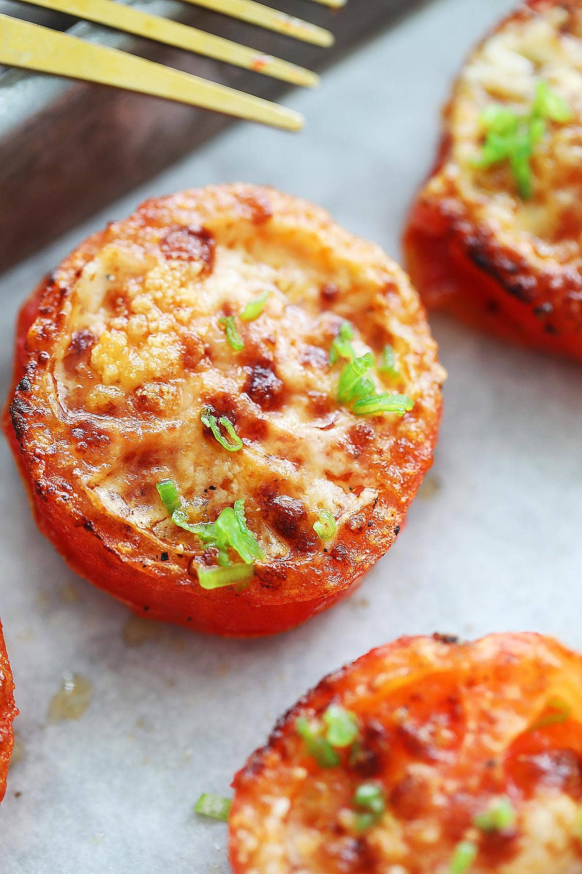 Air fryer tomatoes with Parmesan cheese.