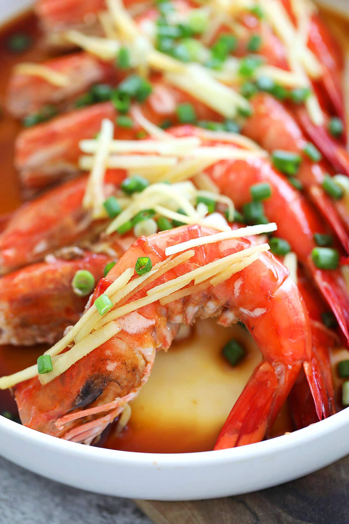 Chinese steamed shrimp topped with ginger and scallions.