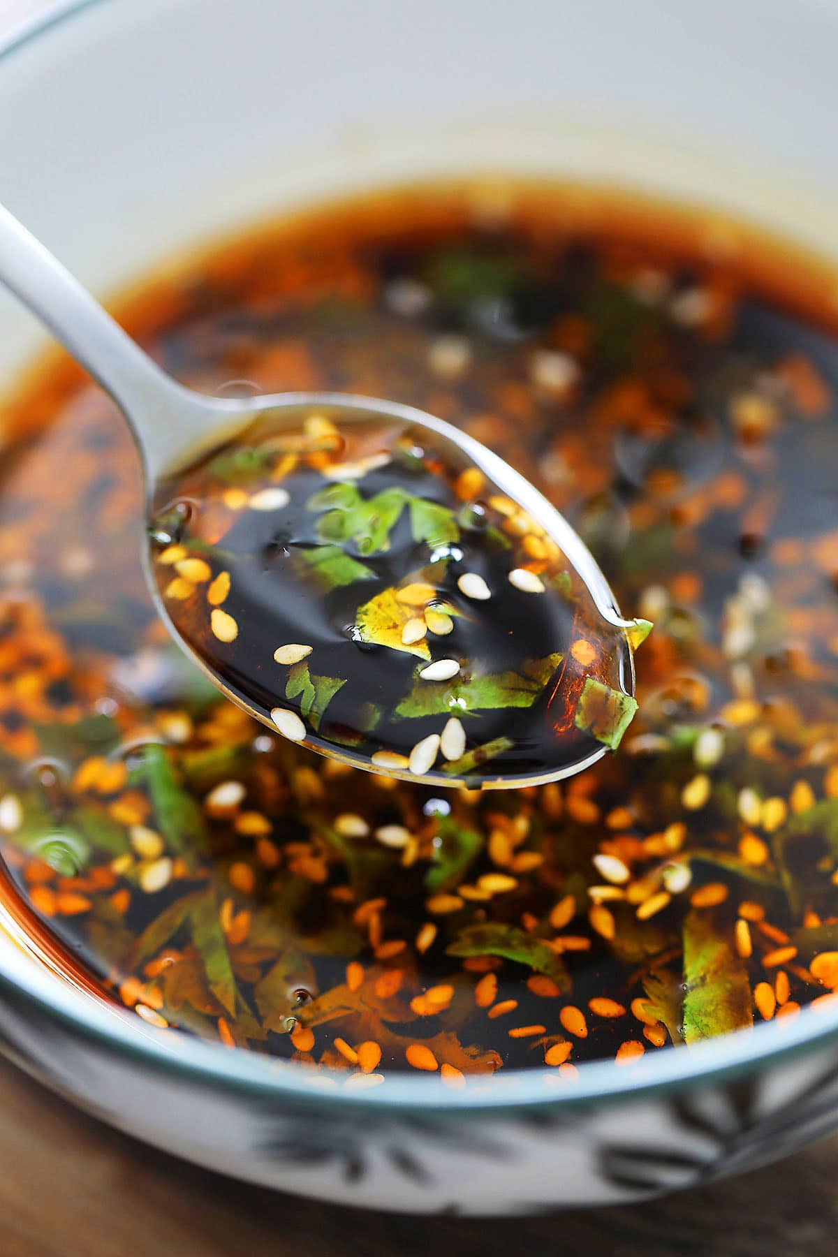 Spoonful of easy homemade spicy dumpling dipping sauce.