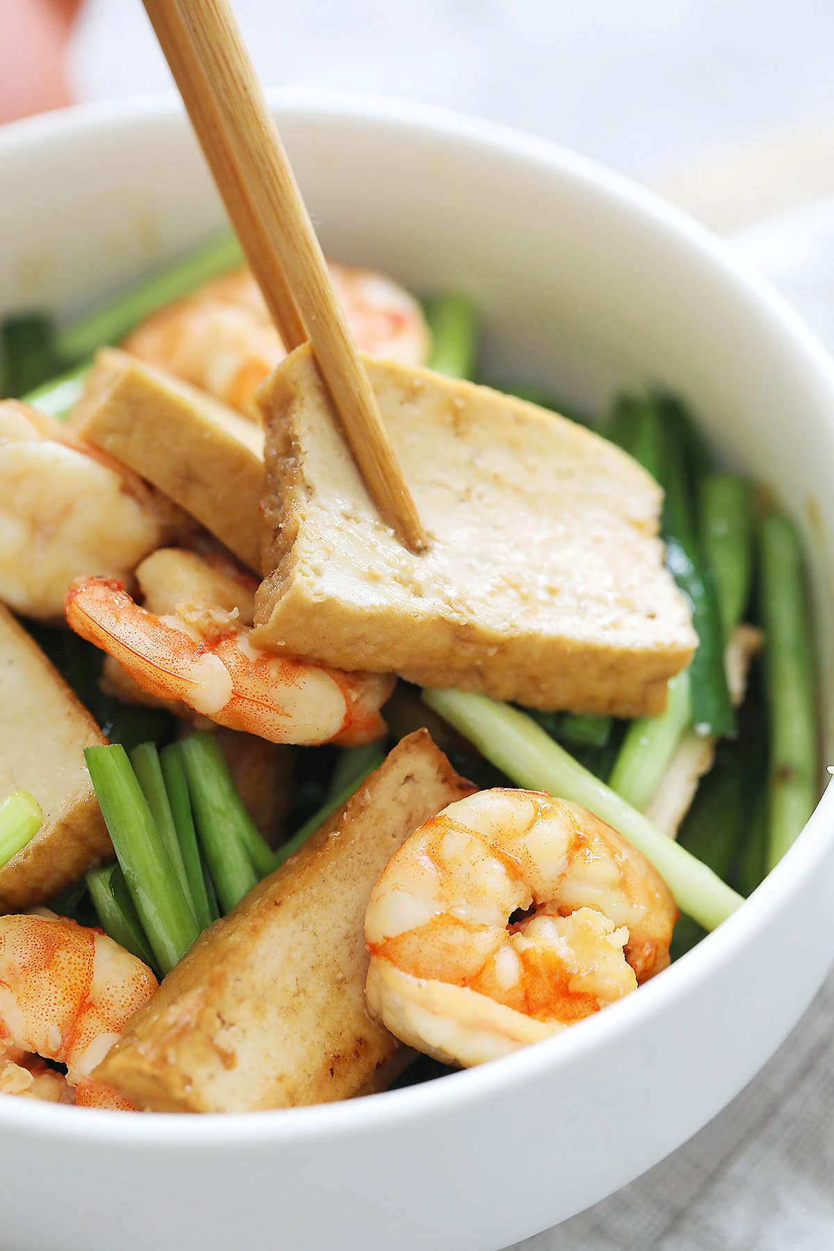 Chinese stir fried veggies with tofu in a bowl.