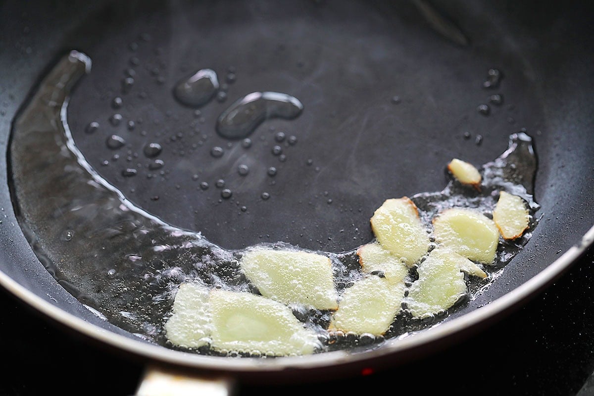 Ginger slices in a pan.
