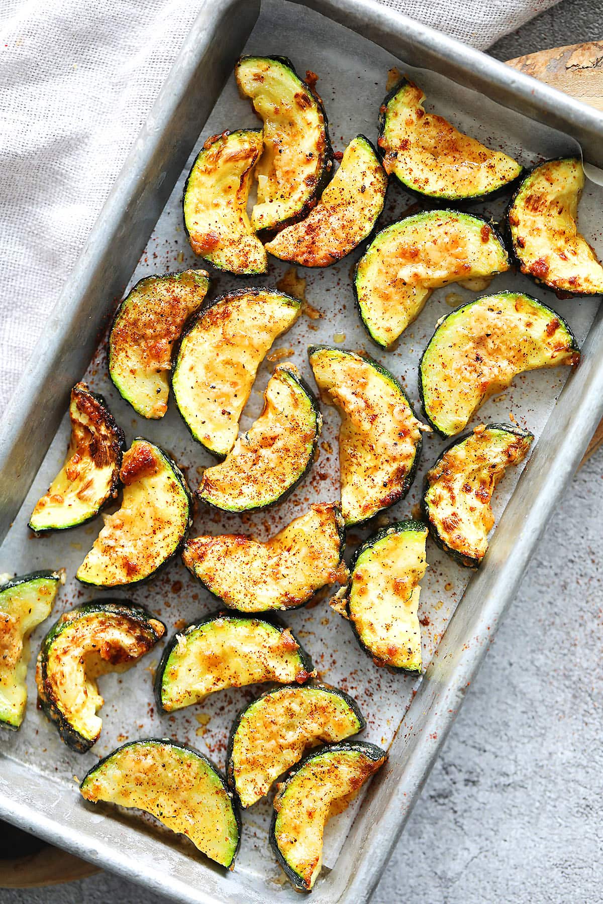 Crispy air fryer zucchini served in a tray.