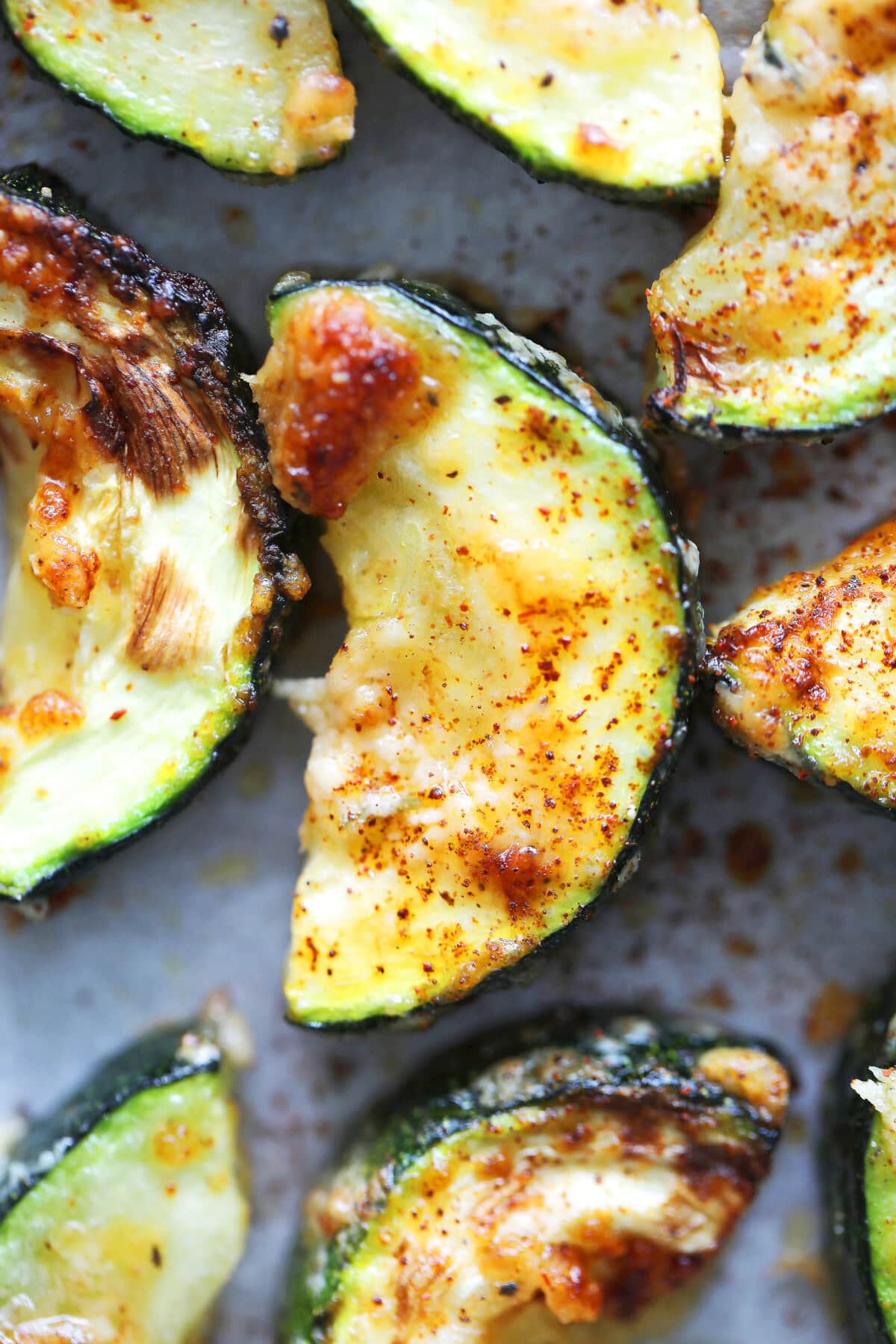 Air fryer zucchini with Parmesan, no breading, topped with paprika.