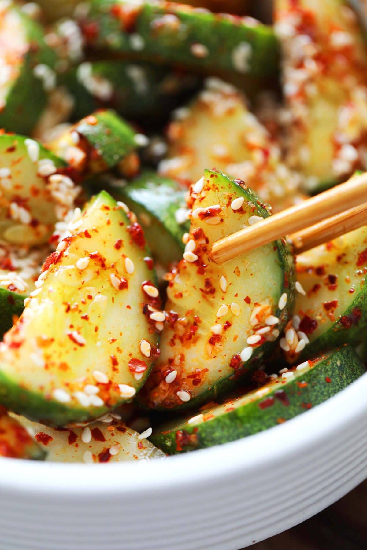 Easy and quick Asian cucumber salad mixed with a flavorful dressing ready for serving.