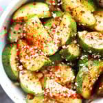 Easy and spicy Asian cucumber salad topped with sesame seeds.