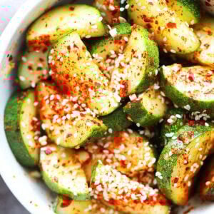 Easy and spicy Asian cucumber salad topped with sesame seeds.