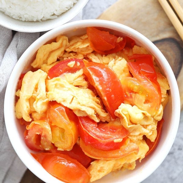 Chinese tomato egg stir fry served in a bowl.