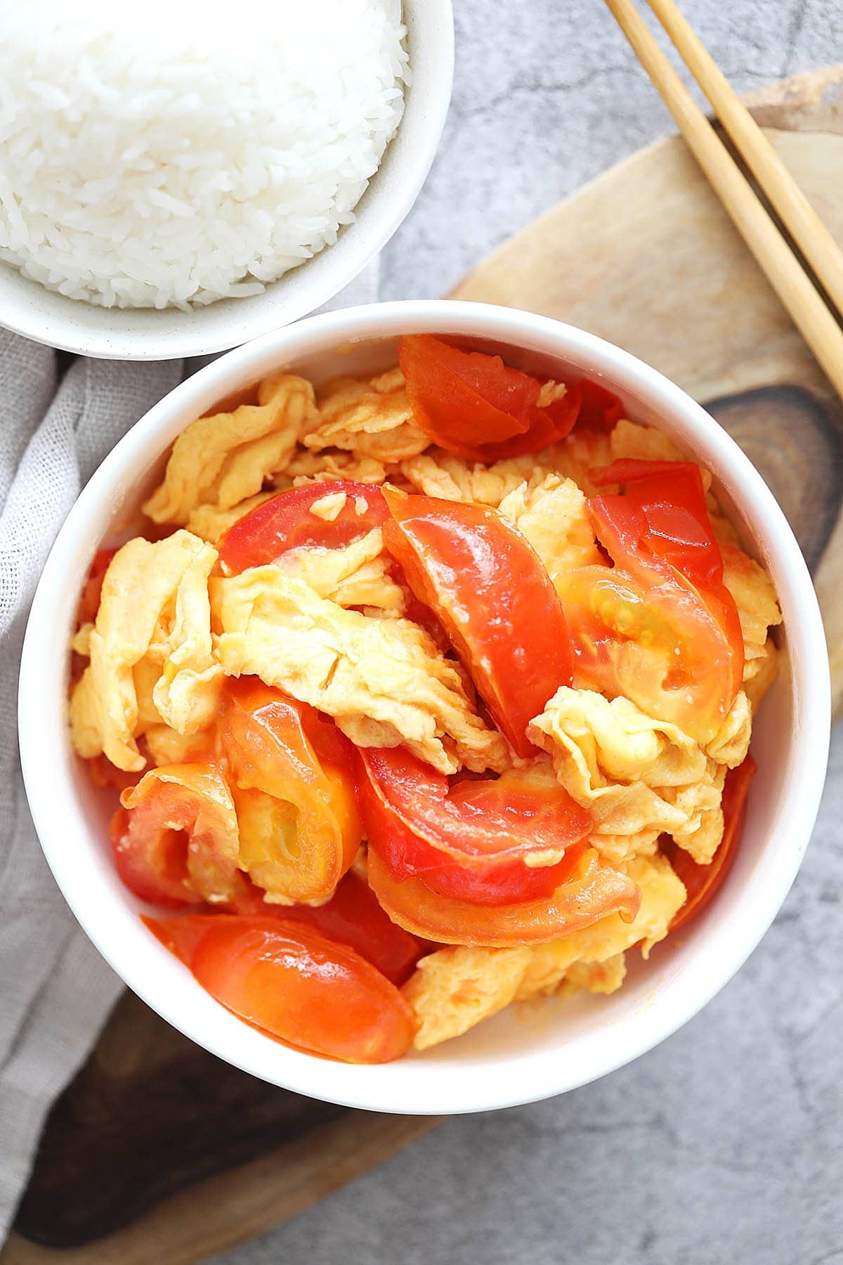 Chinese tomato egg stir fry served in a bowl.