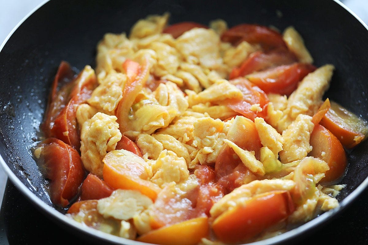 Chinese tomato egg stir fry in a skillet.