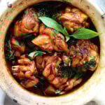 Authentic Taiwanese Three Cup Chicken cooked with sesame oil, soy sauce, Shaoxing wine, garlic, ginger, and fresh basil.