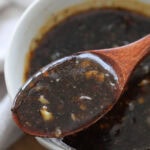 A spoonful of Chinese black pepper sauce.