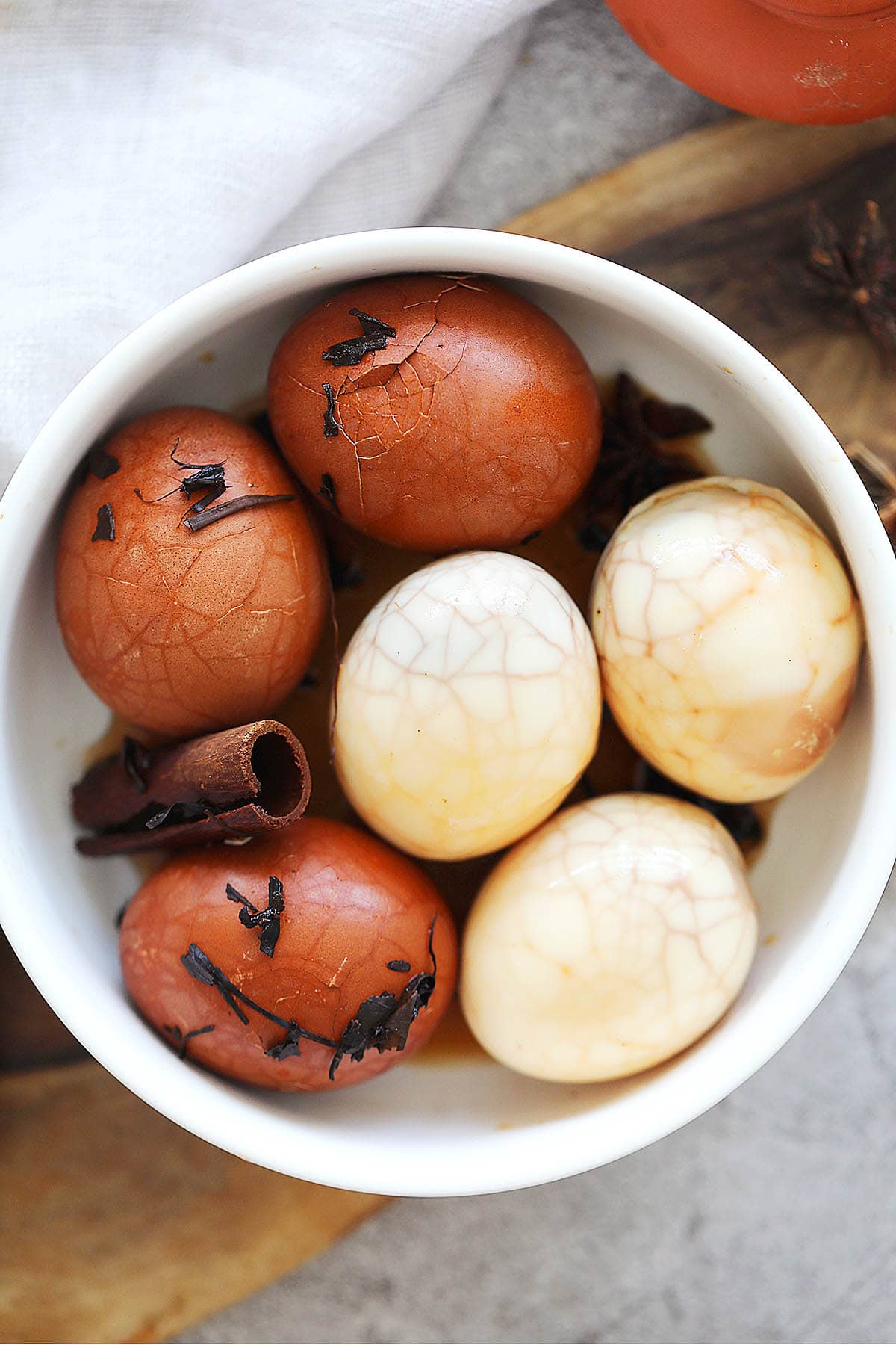 Easy Chinese tea eggs in a bowl, marbled hard boiled eggs.