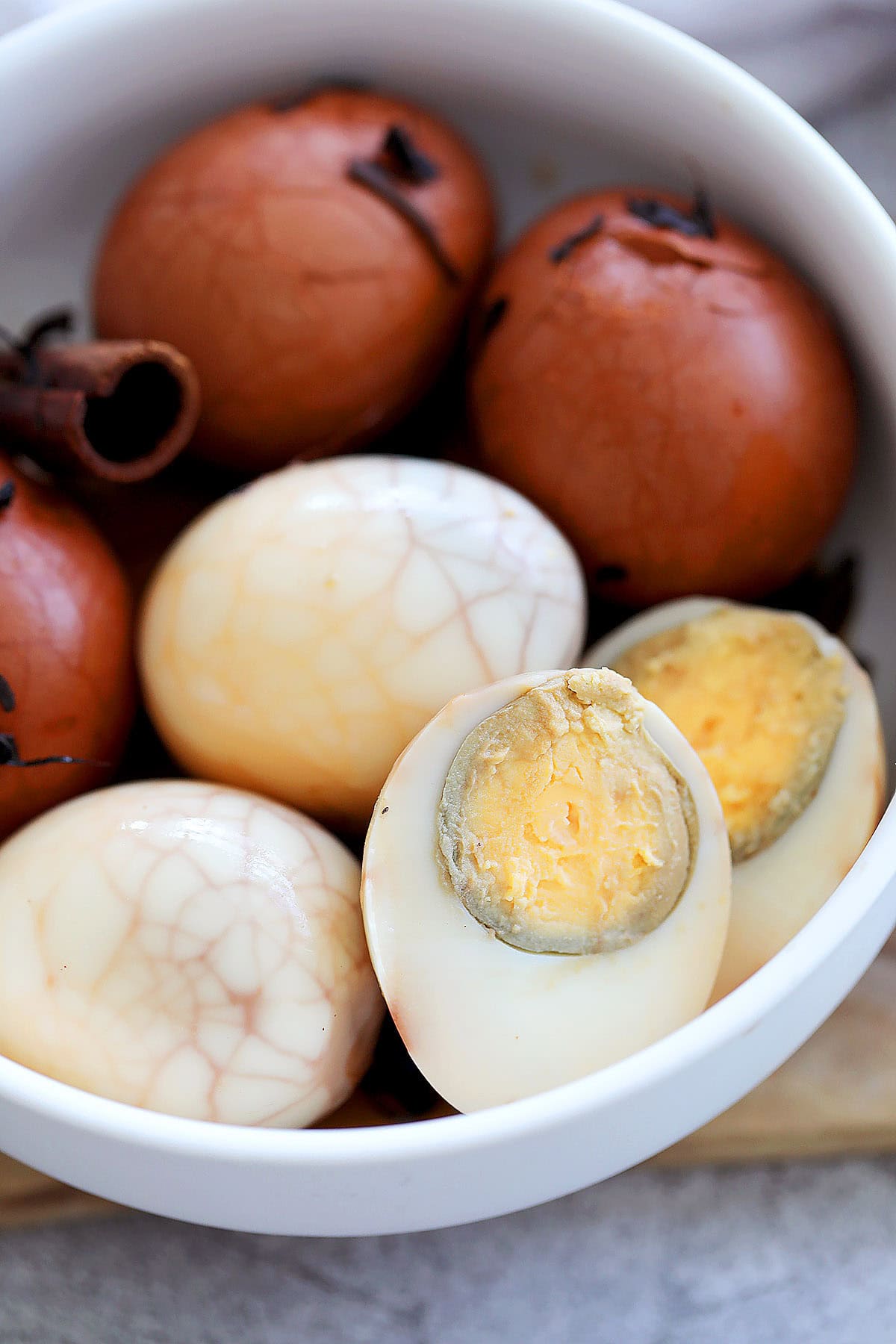Sliced tea egg, hard boiled, marbled pattern on the outside.