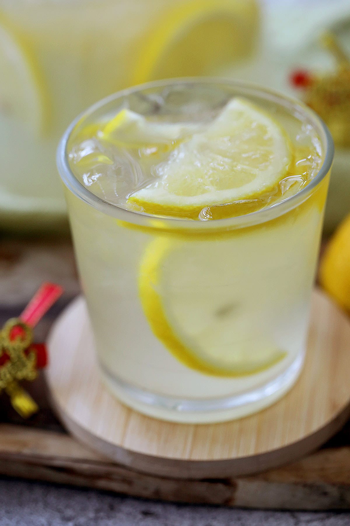 Lemon drop drink in a clear cocktail glass, served on a coaster.