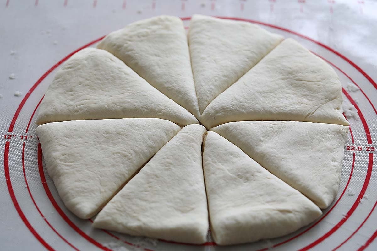 Naan dough sliced into 8 portions.