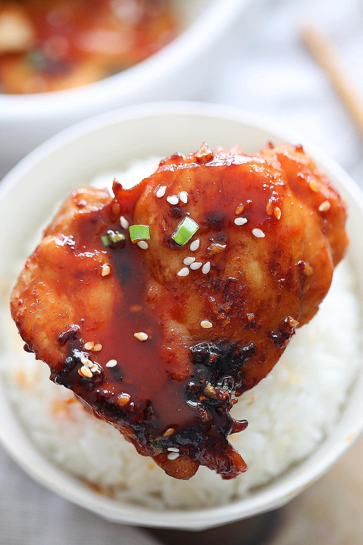 Spicy Korean chicken served on a bowl of rice.