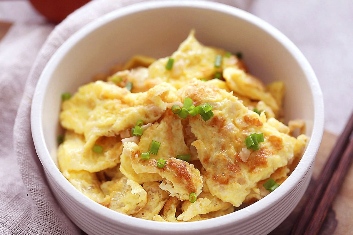 Chinese preserved radish omelette served in a bowl.